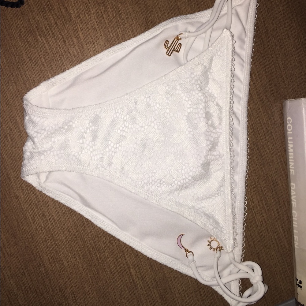 Three VS swim bottoms in size Med.